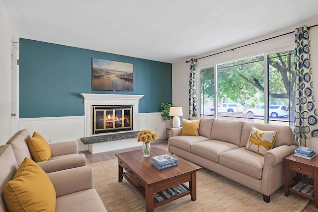621 E Dalke Ave, Spokane, WA 99208 - living area featuring wainscoting, wood finished floors, and a high end fireplace