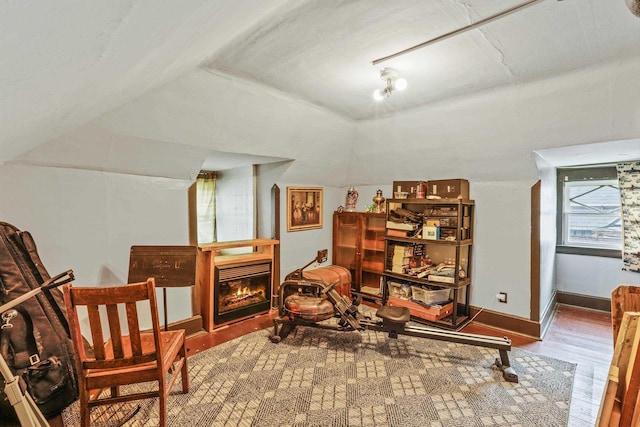 524 W Montgomery Ave, Spokane, WA 99205 - sitting room with wood finished floors, a glass covered fireplace, and lofted ceiling