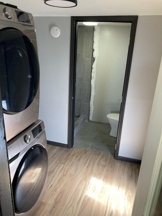 524 W Montgomery Ave, Spokane, WA 99205 - washroom with stacked washer / drying machine and light wood-type flooring