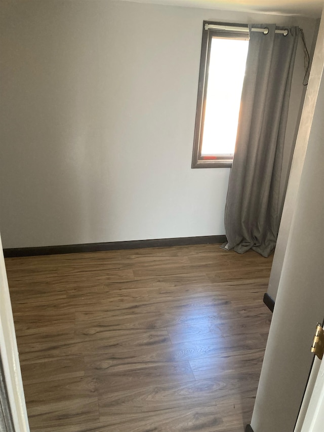524 W Montgomery Ave, Spokane, WA 99205 - empty room featuring wood finished floors and baseboards