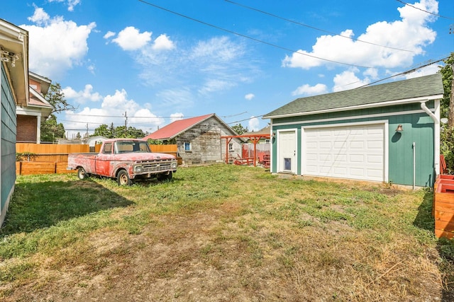 524 W Montgomery Ave, Spokane, WA 99205 - view of yard featuring an outdoor structure and a detached garage