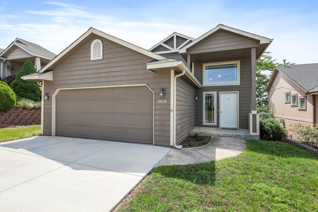 5019 W W Prosperity Ln, Spokane, WA 99208 - view of front facade featuring a garage, concrete driveway, and a front yard