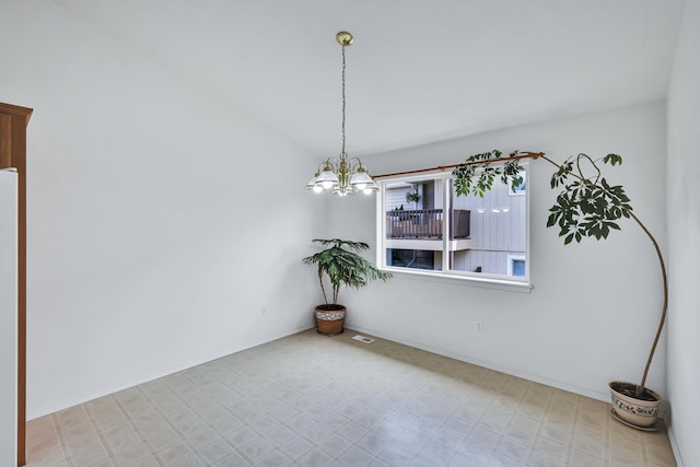 5019 W W Prosperity Ln, Spokane, WA 99208 - spare room with tile patterned floors and a chandelier