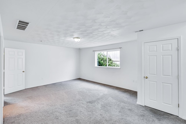 5019 W W Prosperity Ln, Spokane, WA 99208 - unfurnished room featuring carpet flooring and a textured ceiling