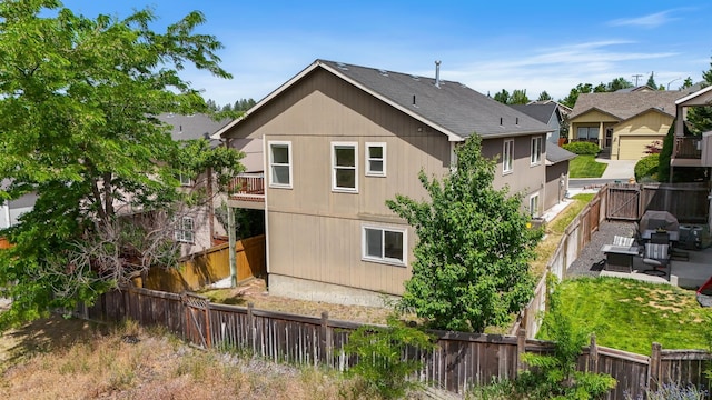 5019 W W Prosperity Ln, Spokane, WA 99208 - back of house featuring a fenced backyard and a patio