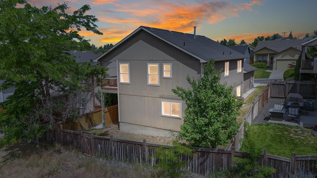 5019 W W Prosperity Ln, Spokane, WA 99208 - back of property with a fenced backyard, a patio, and an outdoor living space