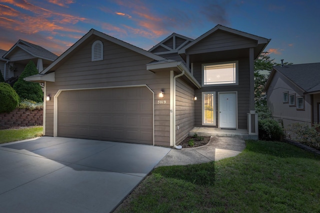 5019 W W Prosperity Ln, Spokane, WA 99208 - view of front facade featuring an attached garage, driveway, and a yard
