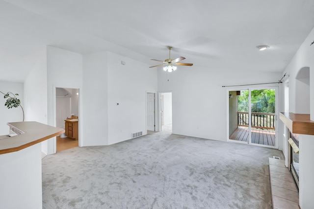 5019 W W Prosperity Ln, Spokane, WA 99208 - unfurnished living room featuring light carpet, ceiling fan, and high vaulted ceiling