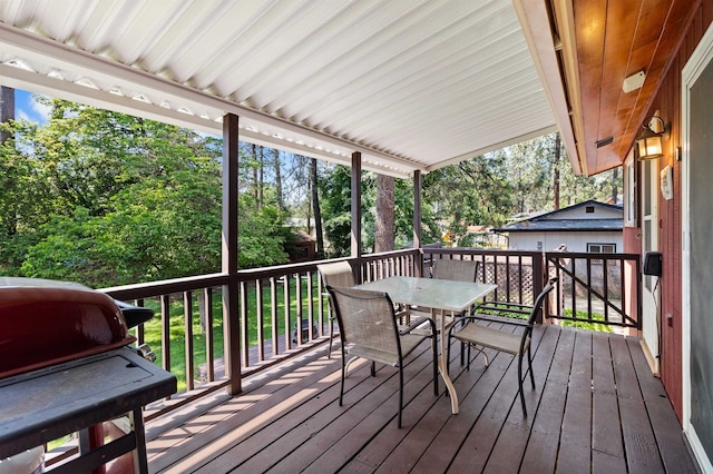 11905 N Atlantic St, Spokane, WA 99218 - deck with outdoor dining space, grilling area, and view of wooded area