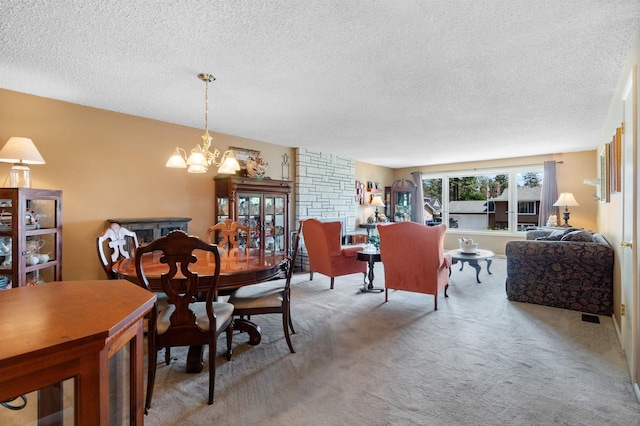 11905 N Atlantic St, Spokane, WA 99218 - dining area with a textured ceiling, a chandelier, and light colored carpet