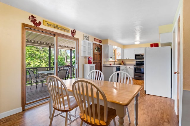 11905 N Atlantic St, Spokane, WA 99218 - dining space with light wood-style floors and baseboards