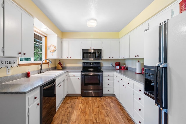 11905 N Atlantic St, Spokane, WA 99218 - kitchen featuring white refrigerator with ice dispenser, stainless steel microwave, electric range oven, dishwashing machine, and light wood-type flooring