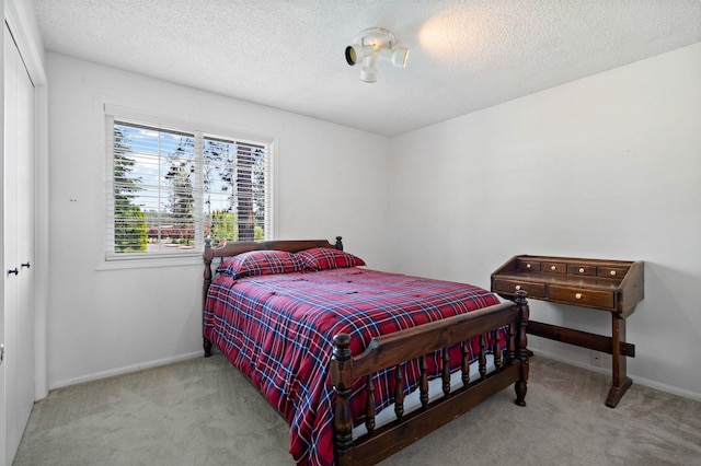 11905 N Atlantic St, Spokane, WA 99218 - bedroom with carpet floors and a textured ceiling