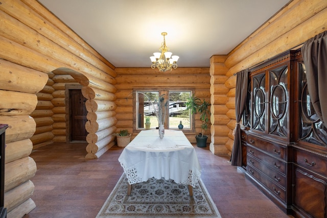 15611 W Pine Bluff Rd, Nine Mile Falls, WA 99026 - dining space with wood finished floors, a chandelier, and rustic walls