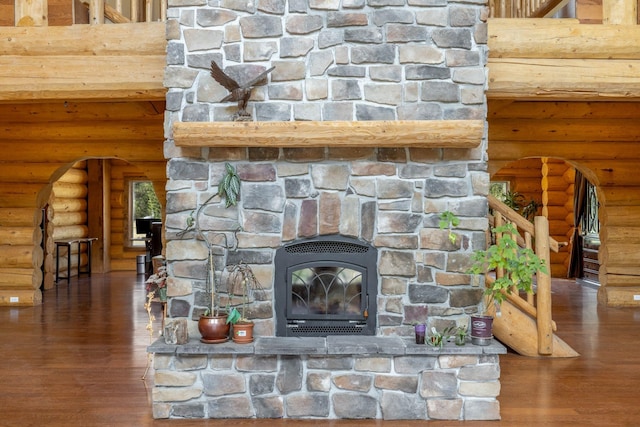 15611 W Pine Bluff Rd, Nine Mile Falls, WA 99026 - detailed view of arched walkways, log walls, wood finished floors, and a fireplace