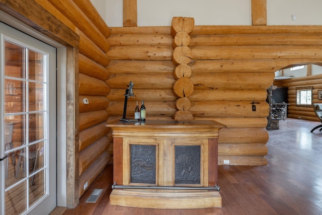 15611 W Pine Bluff Rd, Nine Mile Falls, WA 99026 - detailed view of wood finished floors, rustic walls, and arched walkways