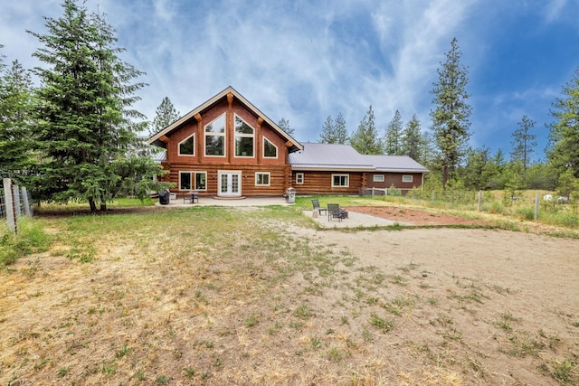 15611 W Pine Bluff Rd, Nine Mile Falls, WA 99026 - back of house featuring an outdoor fire pit, french doors, a patio, and log siding