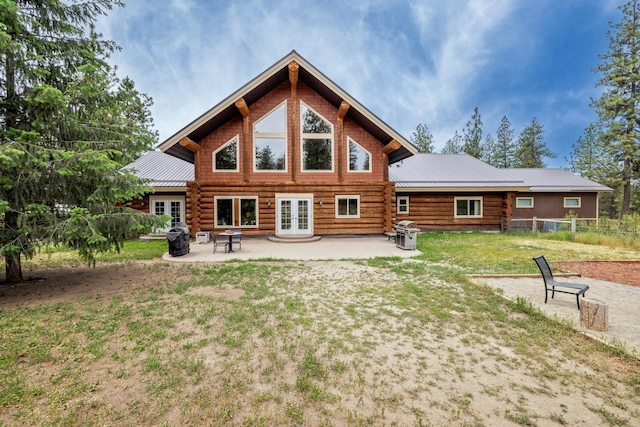 15611 W Pine Bluff Rd, Nine Mile Falls, WA 99026 - back of property featuring french doors, log siding, a patio area, and a metal roof