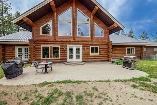15611 W Pine Bluff Rd, Nine Mile Falls, WA 99026 - back of property with french doors, log siding, and a patio