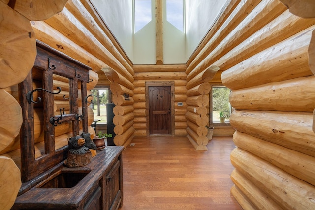 15611 W Pine Bluff Rd, Nine Mile Falls, WA 99026 - entryway with a towering ceiling, wood finished floors, and rustic walls