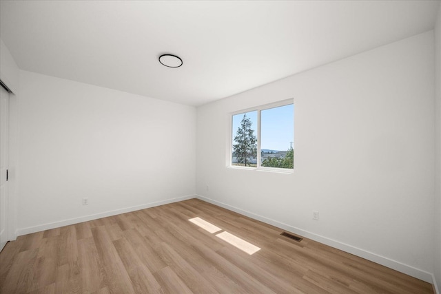2091 W Walker Ave, Spokane, WA 99208 - spare room with light wood-style flooring and baseboards