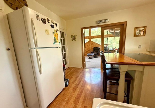 508 N Cedar St, Colville, WA 99114 - kitchen featuring freestanding refrigerator and light wood-style floors