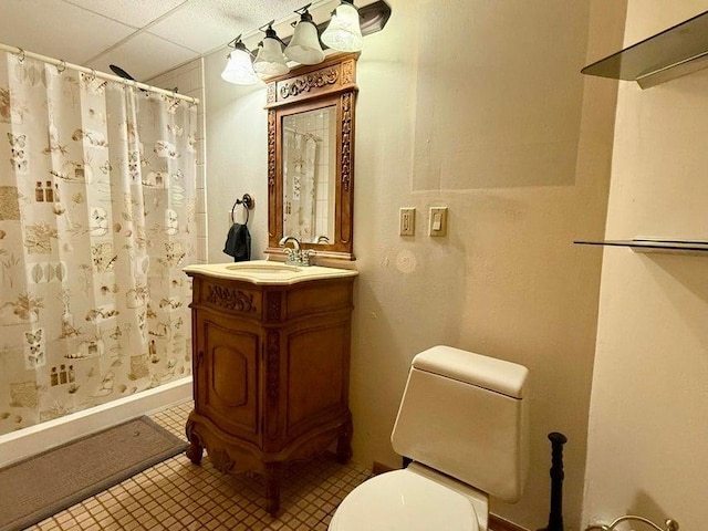 508 N Cedar St, Colville, WA 99114 - full bath with vanity, a shower with shower curtain, tile patterned floors, and a paneled ceiling