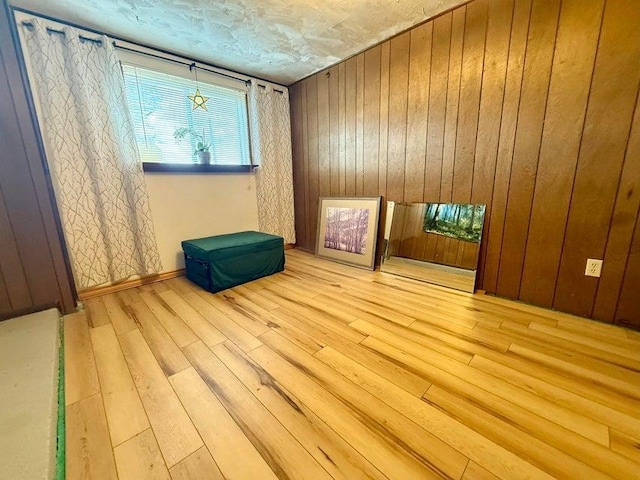508 N Cedar St, Colville, WA 99114 - unfurnished room featuring wood-type flooring and wood walls