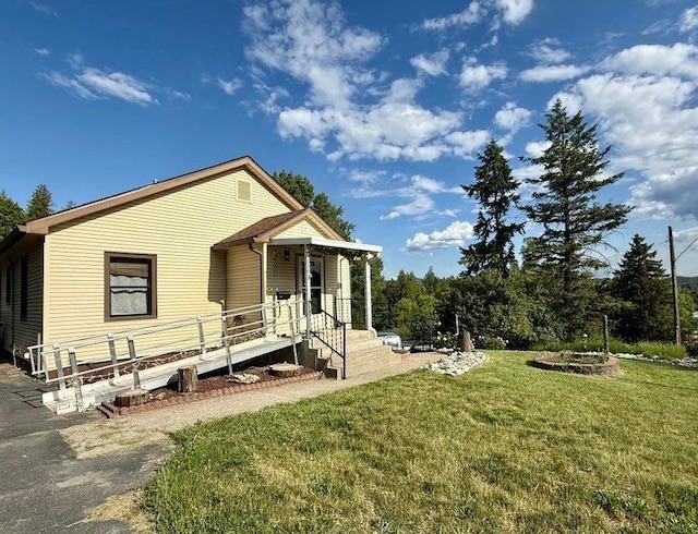 508 N Cedar St, Colville, WA 99114 - back of house featuring a lawn and a porch