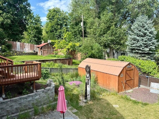 508 N Cedar St, Colville, WA 99114 - fenced yard featuring a storage shed and a deck