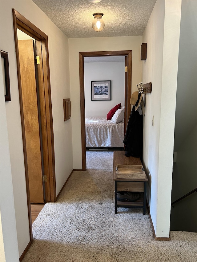 4605 W Pinto Rd, Cheney, WA 99004 - hall with carpet flooring and a textured ceiling