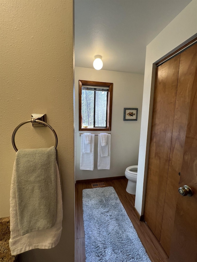 4605 W Pinto Rd, Cheney, WA 99004 - bathroom featuring toilet and wood finished floors