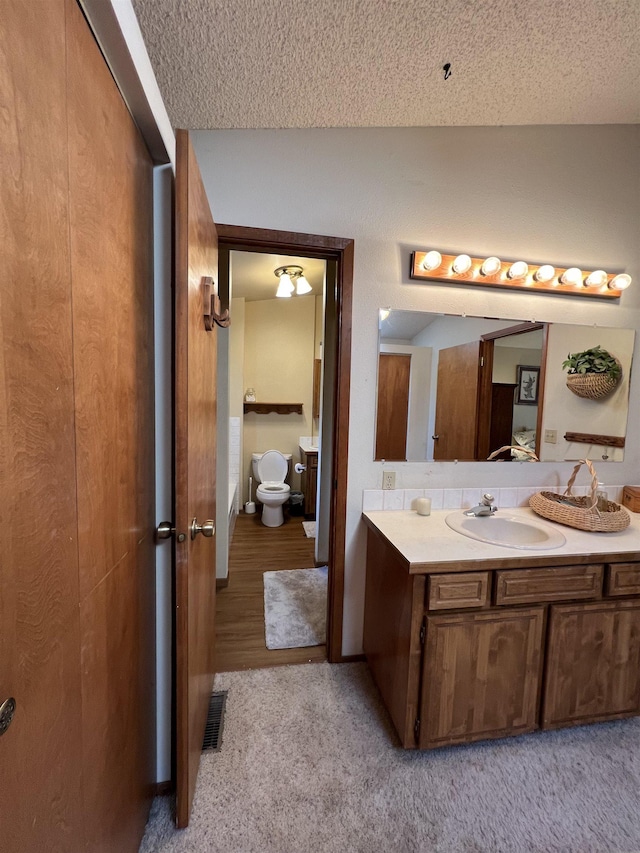 4605 W Pinto Rd, Cheney, WA 99004 - bathroom with vanity and a textured ceiling