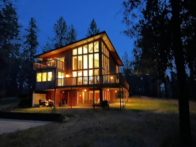 4605 W Pinto Rd, Cheney, WA 99004 - back of house at night with a wooden deck