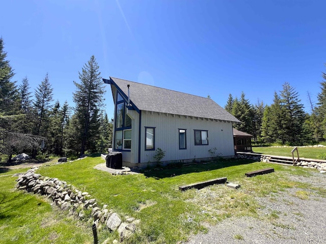 1572 E 20th Hwy, Colville, WA 99114 - view of side of property featuring roof with shingles and a yard