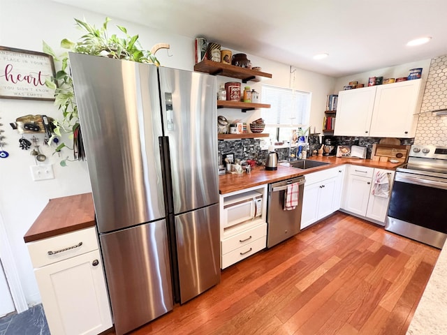 1572 E 20th Hwy, Colville, WA 99114 - kitchen featuring appliances with stainless steel finishes, butcher block countertops, open shelves, and recessed lighting