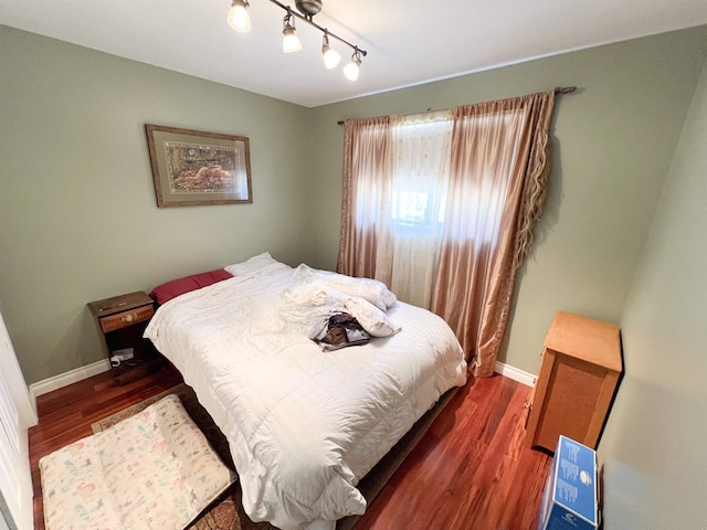 1572 E 20th Hwy, Colville, WA 99114 - bedroom featuring wood finished floors and track lighting