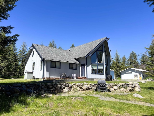 1572 E 20th Hwy, Colville, WA 99114 - view of front of house featuring a garage, roof with shingles, and an outdoor structure