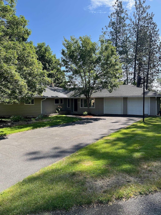 10520 N College Cir, Spokane, WA 99218 - single story home featuring a garage, asphalt driveway, and a front lawn