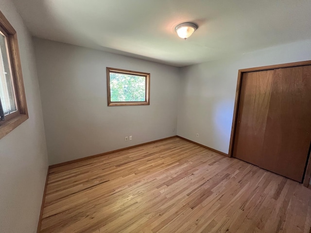 10520 N College Cir, Spokane, WA 99218 - unfurnished bedroom with light wood-style flooring and a closet