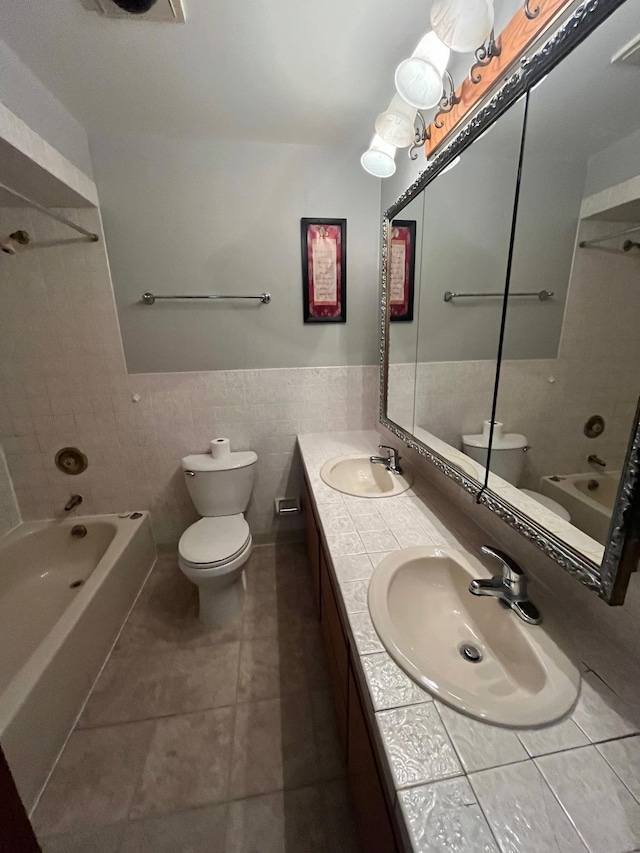 10520 N College Cir, Spokane, WA 99218 - full bath with bathtub / shower combination, tile walls, double vanity, tile patterned floors, and a wainscoted wall