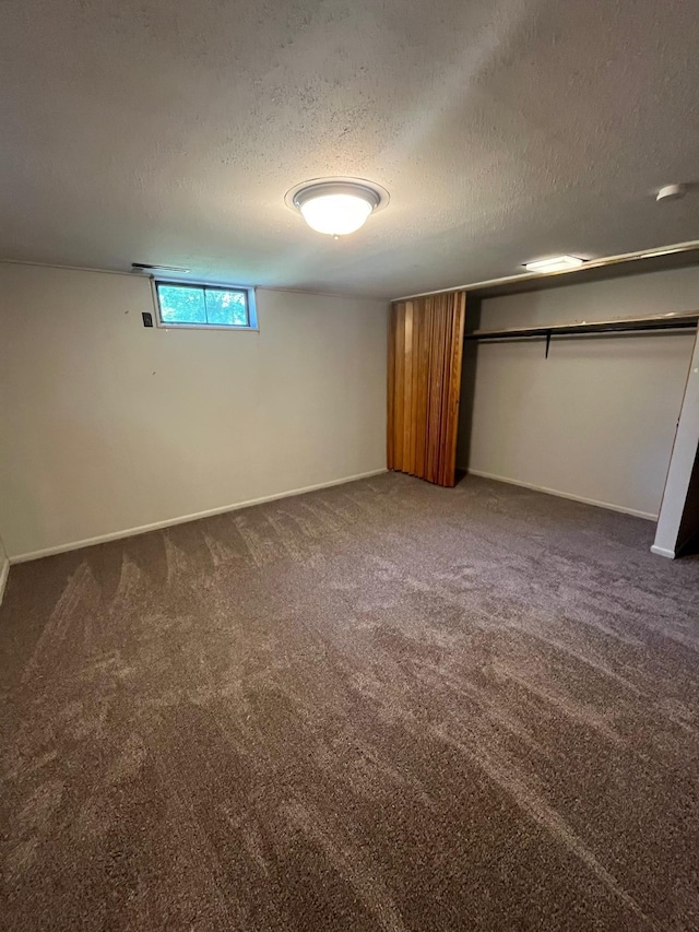 10520 N College Cir, Spokane, WA 99218 - unfurnished bedroom with a textured ceiling, carpet floors, and a closet