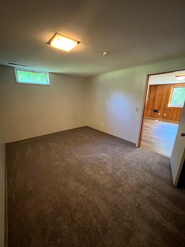 10520 N College Cir, Spokane, WA 99218 - carpeted empty room with wood walls