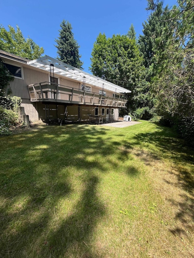 10520 N College Cir, Spokane, WA 99218 - back of house with a deck, a yard, and a patio area