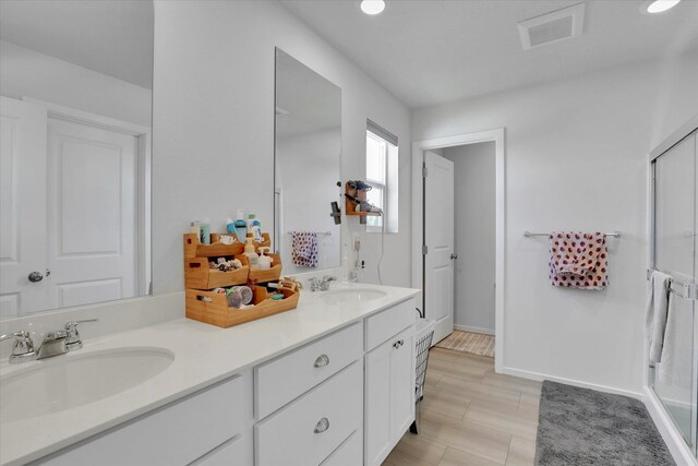 4538 W Brookfield Ave, Spokane, WA 99208 - bathroom featuring double vanity and a shower