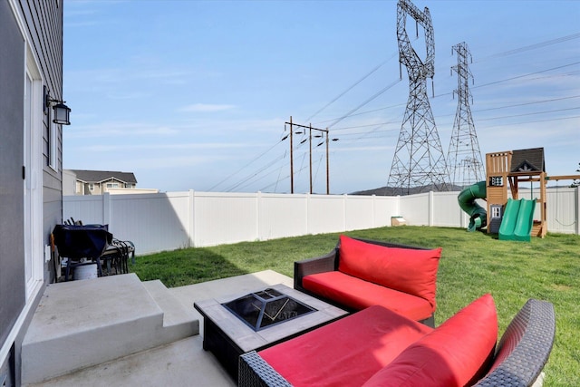 4538 W Brookfield Ave, Spokane, WA 99208 - fenced backyard featuring an outdoor fire pit and a playground
