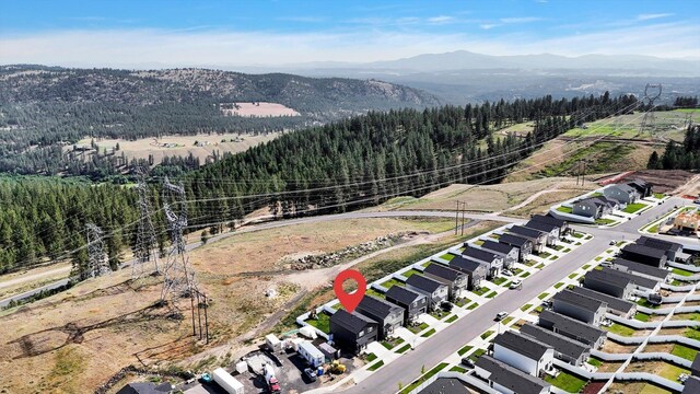 4538 W Brookfield Ave, Spokane, WA 99208 - aerial view of property and surrounding area featuring mountains and a heavily wooded area