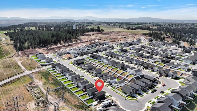 4538 W Brookfield Ave, Spokane, WA 99208 - aerial overview of property's location featuring a mountain backdrop and nearby suburban area