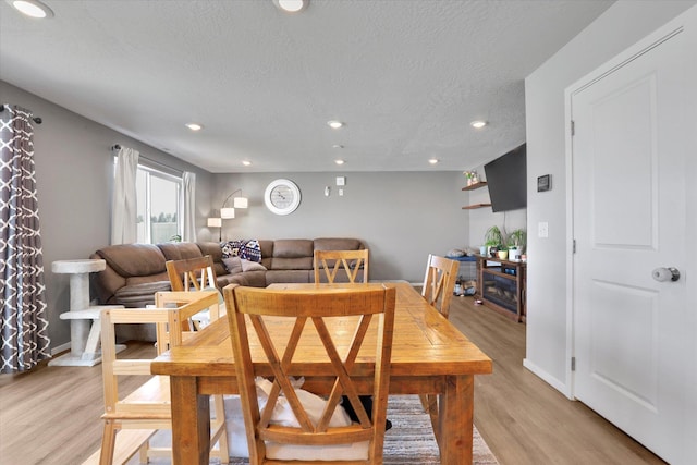 4538 W Brookfield Ave, Spokane, WA 99208 - dining room featuring light wood-style floors, a textured ceiling, and recessed lighting
