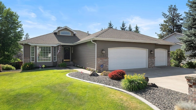 1220 E Brierwood Dr, Spokane, WA 99218 - view of front of home featuring an attached garage, a front yard, driveway, a shingled roof, and brick siding